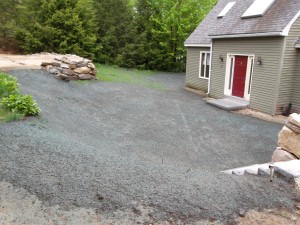New driveway, rock retaining walls, granite steps, granite landing, and hydro-seed in Raymond, NH